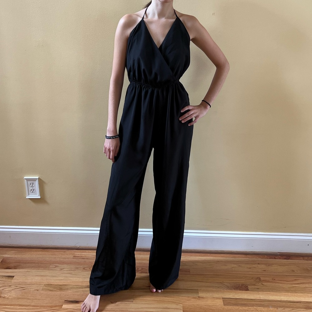 Black jumpsuit open back. Fire Los Angeles. Size M